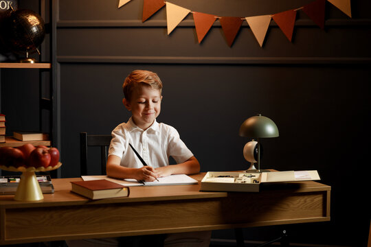 Child Doing Homework with Books and Globe – Back to School Theme