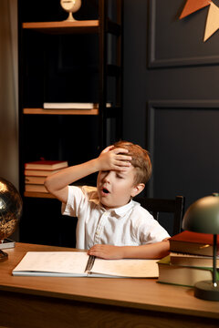 Child Doing Homework with Books and Globe &ndash; Back to School Theme
