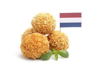 Delicious fried croquette balls, basil and small flag of Netherlands isolated on white