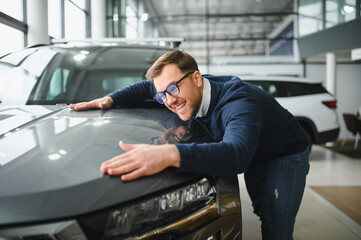 Man buying a car at a showroom