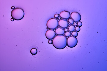 A very beautiful texture of serum or shampoo with bubbles in close-up.