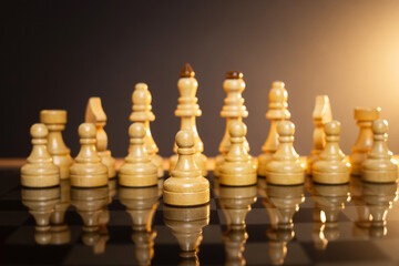 chess pieces on a chessboard on a dark background