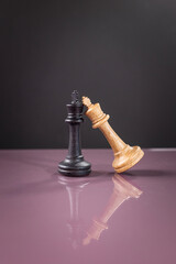 chess piece on purple surface on dark background as business strategy for chess game
