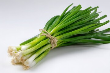 Obraz premium Fresh bunch of green onions tied with twine isolated on white background