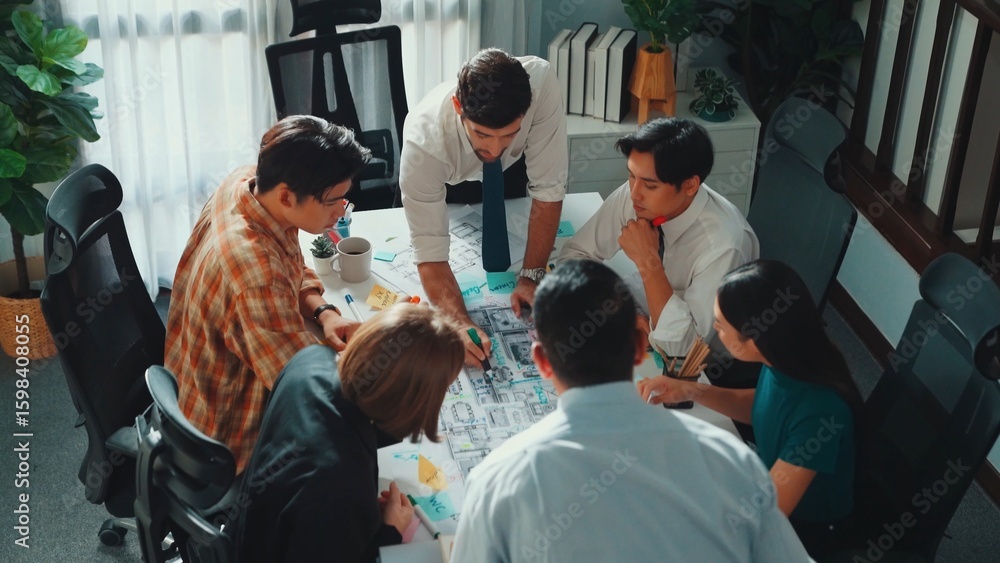 Aufkleber group of diverse team planning strategy while sitting at table with project plan. top aerial view of