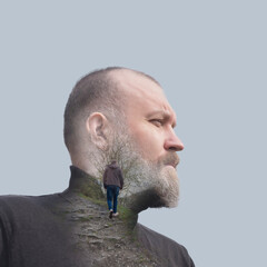 Man with beard looks thoughtfully to the side. Double exposure