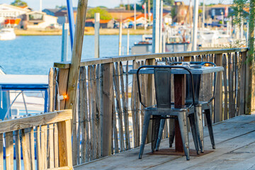 Set dining table at a seaside restaurant by the fishing port