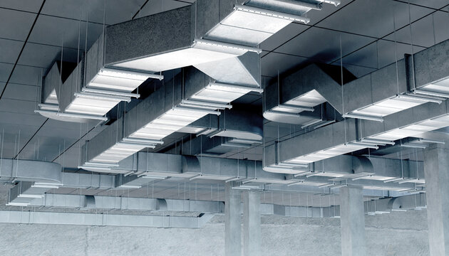 Extensive industrial air duct system mounted on a suspended ceiling for HVAC and air circulation in a commercial facility. Activity: HVAC, Construction, Building Engineering.