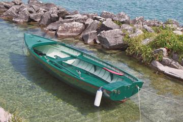 Boat moored in small bay. Yvoire Coast, France