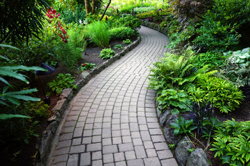 Stone Pathway or Walkway Winding Through Lush Green Garden