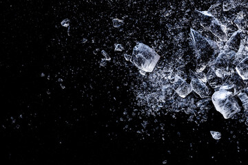 Ice, crushed on a black background. Shards of crushed ice.