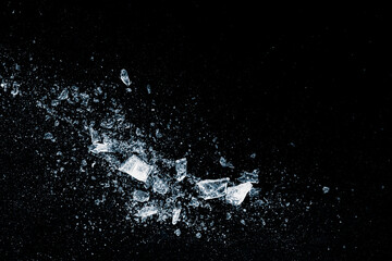 Ice, crushed on a black background. Shards of crushed ice.