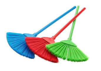 Three colorful plastic brooms blue red and green arranged diagonally isolated on transparent background