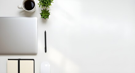 Minimalist Tech Workspace with Laptop, Coffee, and Plants on White Table
