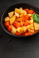 Stewed potatoes with carrots vegetarian side dish fresh delicious gourmet food background on the table rustic food top view copy space keto and paleo diet vegan food