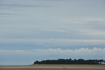 Photo Of A Beautiful Blue Sky And Big Fluffy Clouds Taken From The Beach