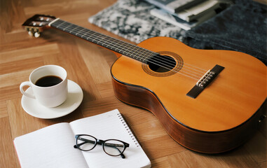 acoustic guitar on wooden background