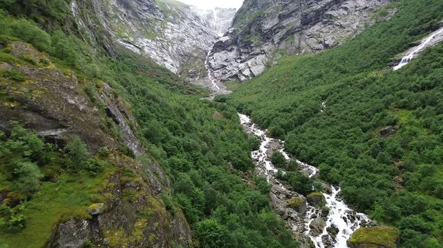Drone View Over Lush Valley and River in Briksdalen, Norway