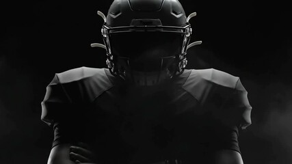 American Football Player in Full Black Gear with Dramatic Low Key Lighting Ready for Intense Action and Professional Sports Performance - Powered by Adobe