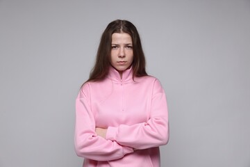 Obraz premium Portrait of teenage girl on light grey background