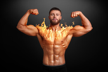 Bodybuilder showing his biceps against black background. Muscular man with flaming chest