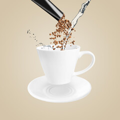 Instant coffee making. Combining granules from sachet and water in cup against beige background