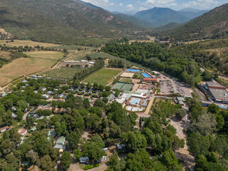 Fototapeta premium Aerial View Popular tourist camping Sagone Campsite hilltop located on the western coast of Corsica island Corse France