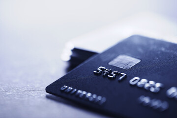 Many different credit cards on grey table, closeup