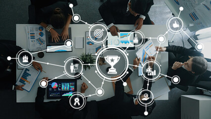 Collaborative Business Meeting with Diverse Team Analyzing Data Reports and Visuals in Modern...