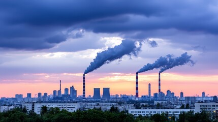 Fototapeta premium Smoke Emission from Industrial Towers at Sunset Horizon