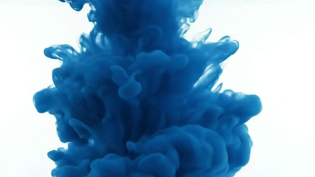 Abstract blue ink cloud expanding underwater against white background beautiful fluid motion art dye explosion liquid paint texture dissolve effect