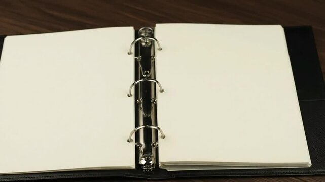 Open black binder blank white pages wooden desk background for business school office notes ideas presentations planning writing clean empty template creative s