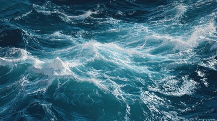 Turbulent ocean waves. Deep blue water surface with foamy white crests. Strong movement and texture
