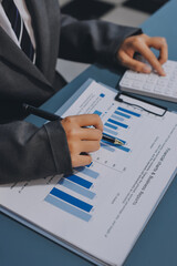 Business financing accounting banking concept. Business woman hand doing finances and calculate on...