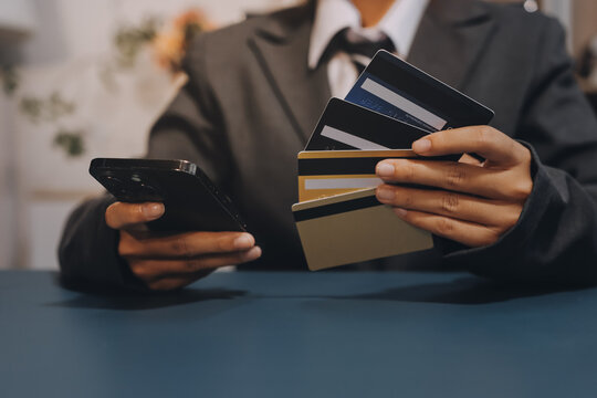 Online payment,businessman hands holding credit card and using laptop for online shopping. Cyber Monday Concept