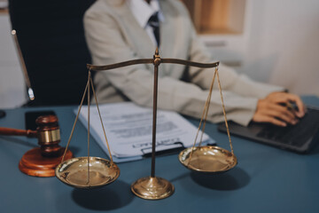 Judge gavel with Justice lawyers having team meeting at law firm background. Concepts of Law and...