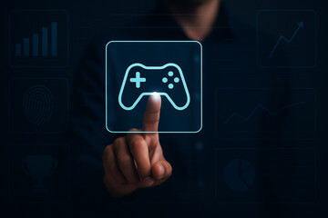 Futuristic man touching virtual holographic game controller interface with icons, modern digital technology gaming UX concept for websites