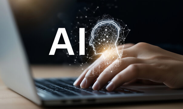 Hands typing on a laptop with an AI digital head icon, symbolizing artificial intelligence and future technology. Internet concept of Internet - Powered by Adobe