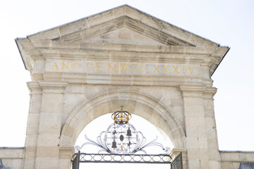 Historical archway at Jardines del Palacio Real de la Granja in Spain celebrating the year 1874