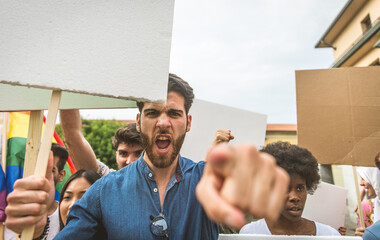 Public demonstration on the street against social problems and human rights. Group of multiethnic...