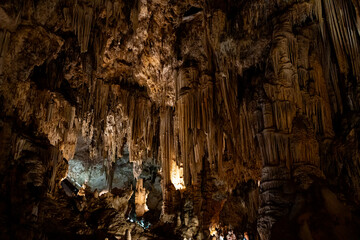 Stunning stalactites and stalagmites adorn the breathtaking cave network in Málaga, Spain,...
