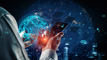 A conceptual image showcasing a person using a smartphone while interacting with global network connections and digital data visualizations in a futuristic setting. Xenic