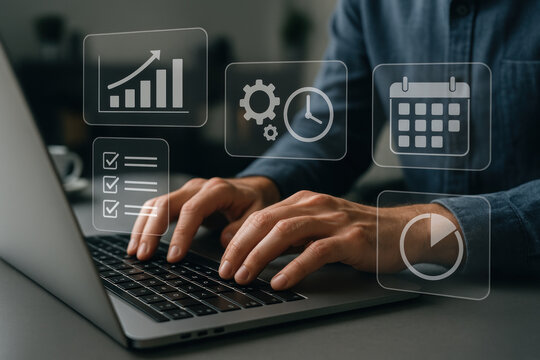 Business person using laptop with data icons. Photos