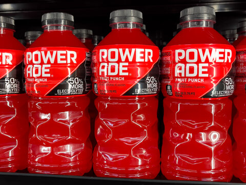 ATLANTA, GEORGIA - JULY 21 2025 : Powerade red fruit punch sports drink bottles on display at grocery store supermarket.