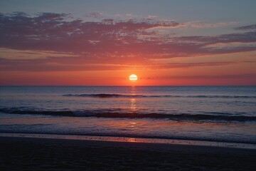 Breathtaking Ocean Sunset Over Shoreline Silhouette at Dusk