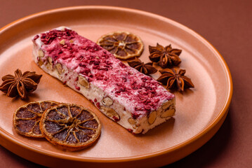 Nougat or white caramel with hazelnuts and strawberry pieces. White nougat