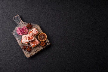 Nougat or white caramel with hazelnuts and strawberry pieces. White nougat