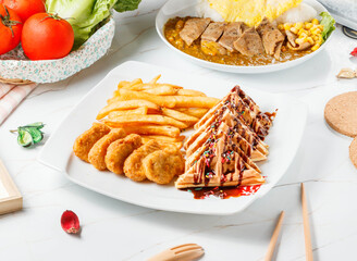 Sweet and Savory Waffle with Chicken Nuggets, Fries Classic Comfort Food in plate side view of hong kong foodSavory Kung Pao Chicken Teppanyaki Noodles
