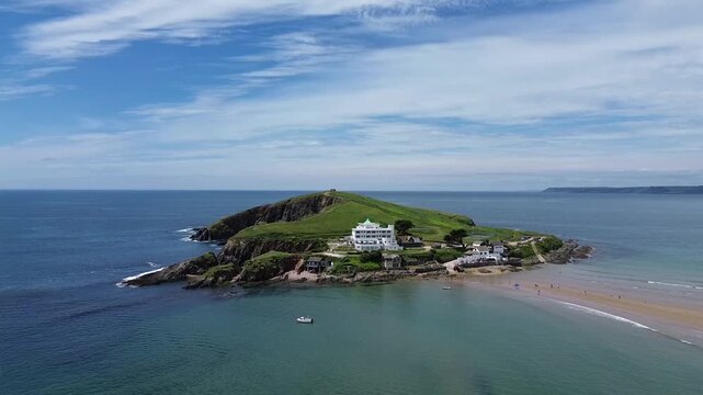 Drone view of Burgh Island. Aerial footage of Bigbury beach, Fisherman's Lookout, Bigbury On Sea in Kingsbridge, Devon England famously known as a writer's retreat for Agatha Christie
