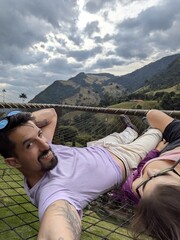 interracial Couple Enjoying Relaxation and Connection – Hammock, Resort, Nature, Joy, Calm, Peace, Tropical Climate, Lounge, Smiling, Tranquility, Outdoors, Comfortable